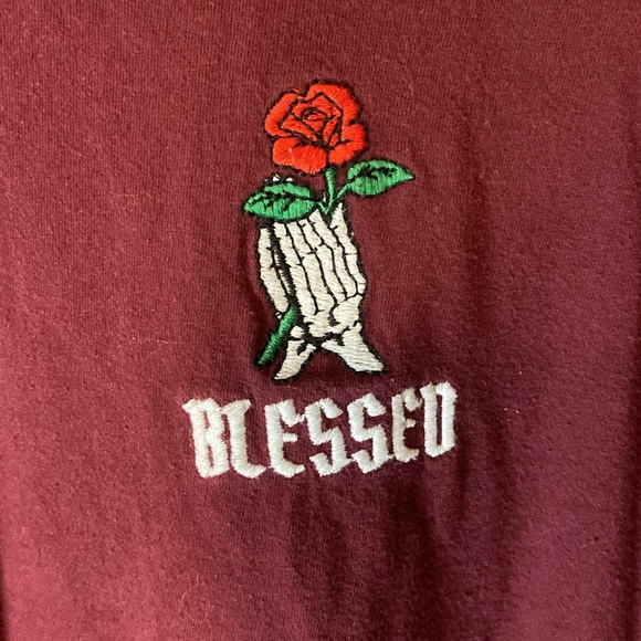 SKELETON HANDS HOLDING A ROSE LOGO THAT SAYS “BLESSED” ON A BURGUNDY LONG SLEEVE - Picture 3 of 5